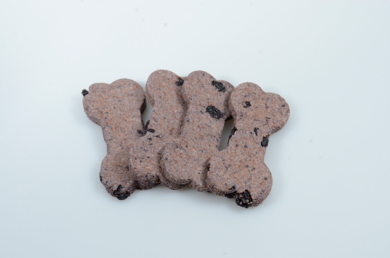 Blueberry-colored bone-shaped dog treats