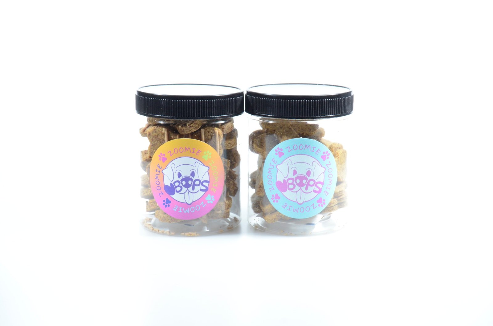 Two jars of Zoomie Boops dog treats with branded labels