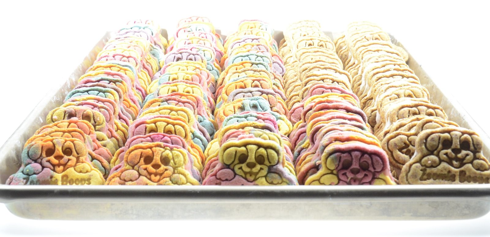 A tray filled with colorful Zoomie Boops dog treats